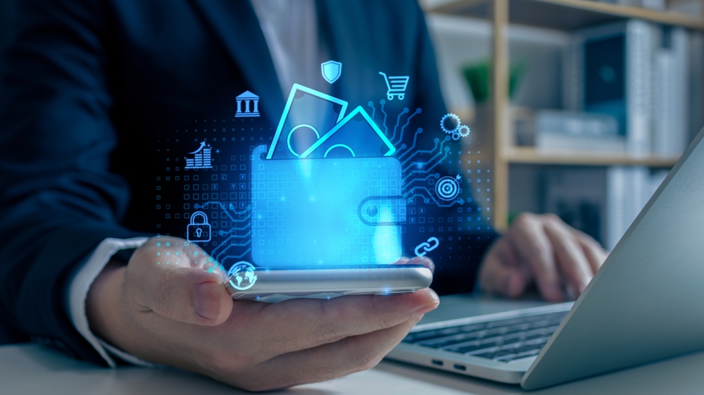 Empresario usando tel&eacute;fono m&oacute;vil para conectar cartera digital.